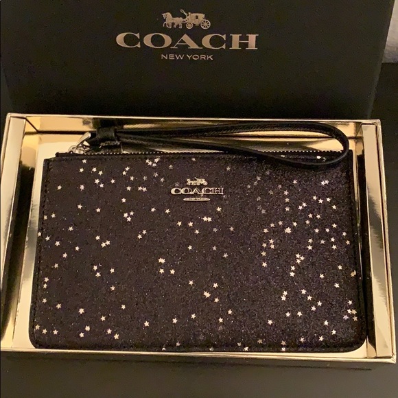 Coach Handbags - NWB. Coach star ⭐️ black wristlet.